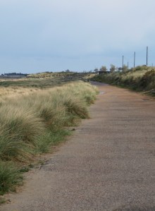 Ruth's coastal walk: road beside beach, leading to Caister-on-Sea