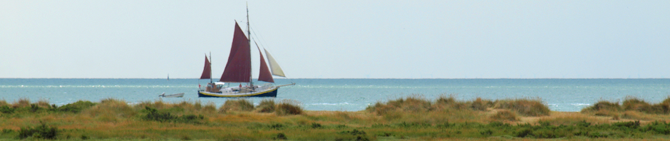Red sailed ship, Jaywick beach.