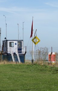 Yellow sign on Shoeburyness beach, Ruths coastal walk, Essex