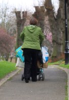 Woman with laden pushchair, Gillingham, Ruth's coastal walk Woman with laden pushchair, Gillingham, Ruth's coastal walk