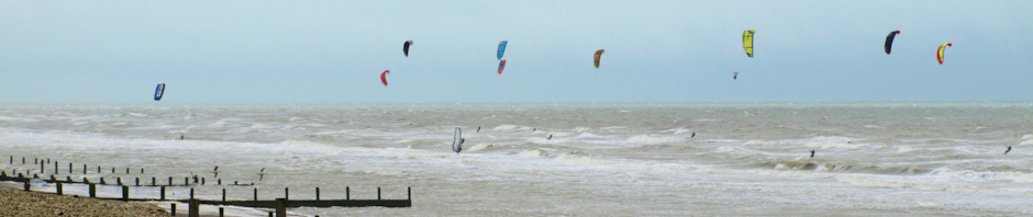 HEADER - kite surfers and wind surfers, Camber Sands, Ruth's coast walk.
