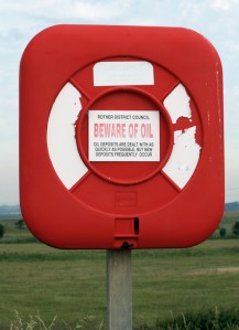 sign about oil, Norman's Bay, Sussex. Ruth walks round the coast. sign about oil, Norman's Bay, Sussex. Ruth walks round the coast.