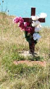 Memorial at Beachy Head, cross and flowers, Ruth's coastal walk.