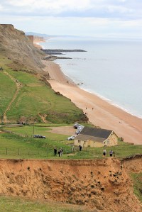 Eype's mouth and Portland in distance, Ruth walks the Dorset coastline