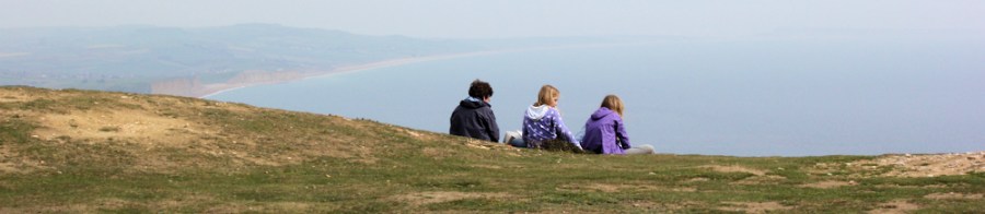 top of Golden Cap, Dorset, Ruth walking round the coast.