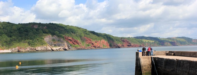 view across Babbacombe Bay, Ruth walking the coastline of the UK