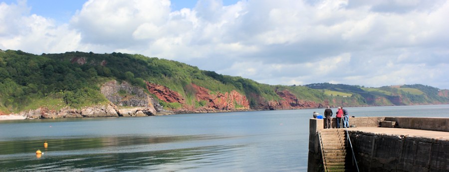 view across Babbacombe Bay, Ruth walking the coastline of the UK