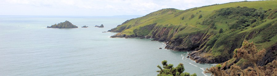 Mew Stone, Start Point beyond, Ruth on South West Coast Path, Devon