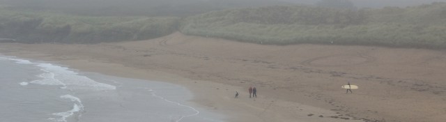 Bantham Beach in the mist, Ruth on her coastal walk. Devon