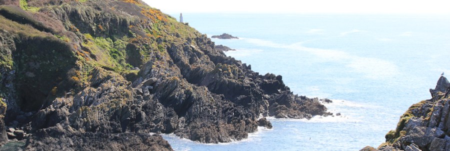 on Chapel Cliff, Polperro, Ruth walking round the coast