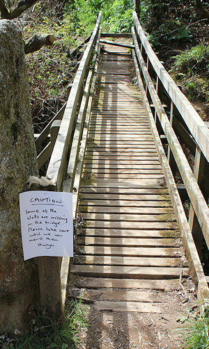 bridge with slats missing- sign on Ruth's walk, St Austell Bay