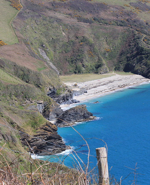 looking back on Lantic Bay, Ruth on the South West Coast Path