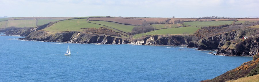 approaching Fowey, Ruth walking the UK coastline