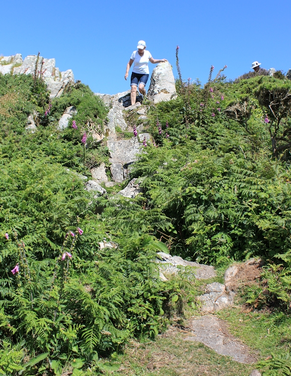 rocks and walkers, Trevean Cliff, Ruth on South West Coast Path, Cornwall