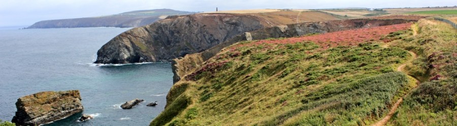 Gullyn Rock, towards Agnes Head, Ruth walking the South West Coast Path