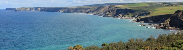 04 view ahead to Tintagel across Port Isaac Bay, Ruth on SWCP