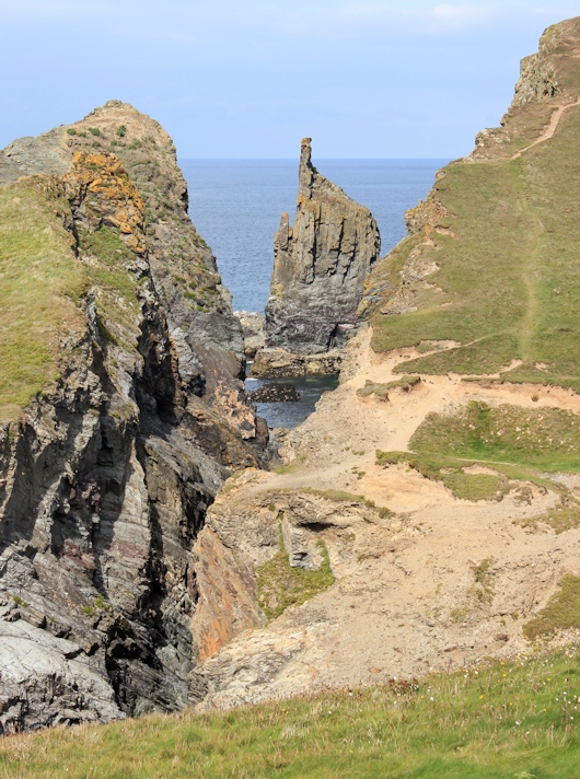 rocks Longcarrow Cove, Ruth walking the Cornish coast