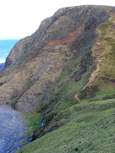 Scrade Valley Waterfall, Ruth walking the South West Coast Path in Cornwall