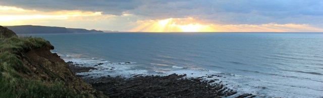 Sunset over Tintagel, Ruth on her coastal walk, Cornwall