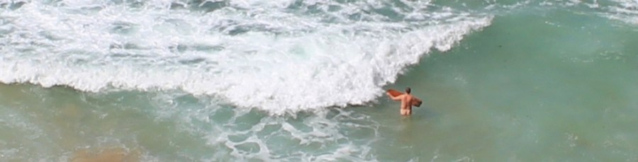 nude surfboarder, Carnewas, North Cornwall