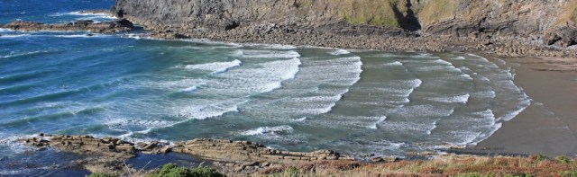  surfers on beach, Crackington Haven, Ruth's coastal walk in Cornwall