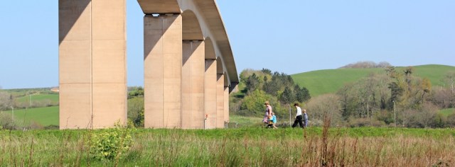 walking under Torridge Bridge, Bideford, Ruth on the SW Coast Path