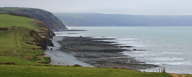 looking back along cliffs to Buck's Mills, Ruth on the South West Coast Path