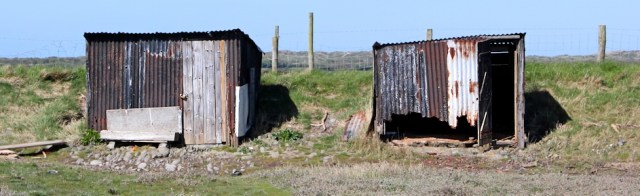 fishing shacks, Ruth walking down River Caen, Braunton