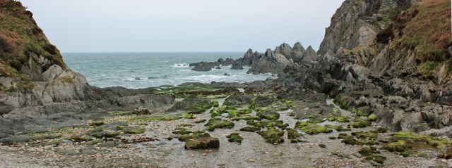 Damagehue Rock, Ruth walking the SWCP, near Mortehoe, Devon
