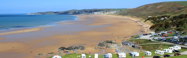 looking along Woolacombe Sand, Ruth walking the coast, North Devon
