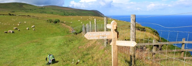 signposts on the SWCP, north Devon, Ruth walking around the UK