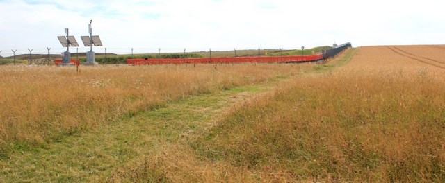 Hinkley Power Station EDF, perimeter, Ruth walking the Somerset coast
