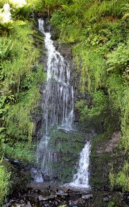 waterfall, Ruth walking the SW coast path, north Devon