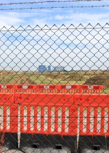along the perimeter of Hinkley Power Station, Ruth trying to walk the Somerset coast