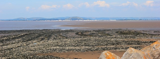 Burnham on Sea across Bridgwater Bay, Ruth walking the coast, Somerset
