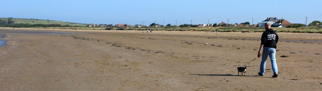 nearly deserted Sand Bay, near Weston-super-Mare, Ruth walking the Somerset coast