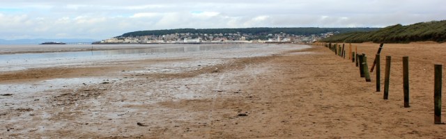 Ruth walking up Weston Bay, towards Weston super Mare