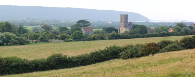 Woodspring Priory, Ruth walking the Somerset coast