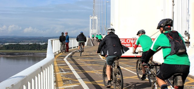 cyclists on the Severn Bridge, Ruth walking the coast