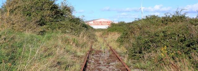 b12 railway line going nowhere, Ruth walking up the Severn Estuary