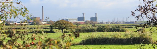  power station on other side River Usk, Ruth walking the Welsh coast path