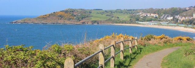 Langland Bay, Ruth walking the Wales Coast Path