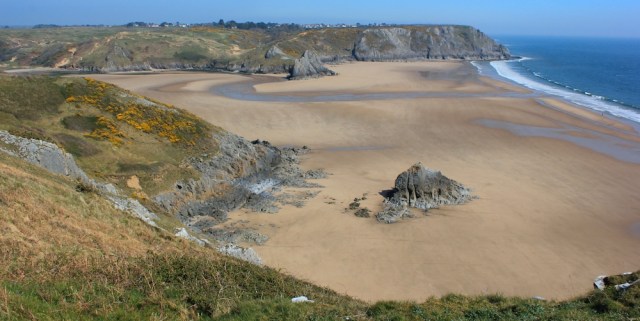 Three Cliff Bay, Ruth walking in Gower, Wales Coast Path