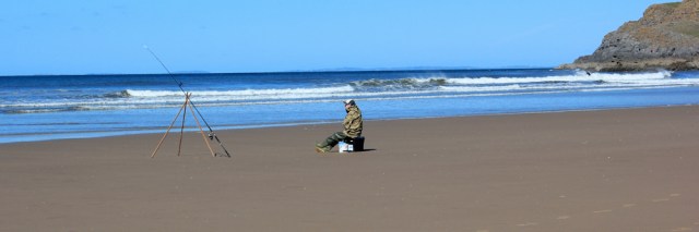 Fisherman, Rhossili Beach, Ruth walking the Wales Coast Path