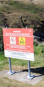 Danger sign on Twlc Point, Ruth Livingstone hiking in Gower, Wales
