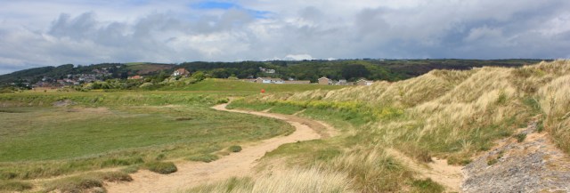 a09 path along edge of Pembrey Dunes, Ruth walking the Wales Coast Path