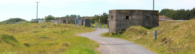 a12 pillbox near entry to Pembrey Country Park, Ruth walking the coast in Wales