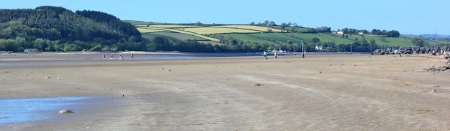a18 beach at Ferryside, Ruth walking the Wales Coast Path