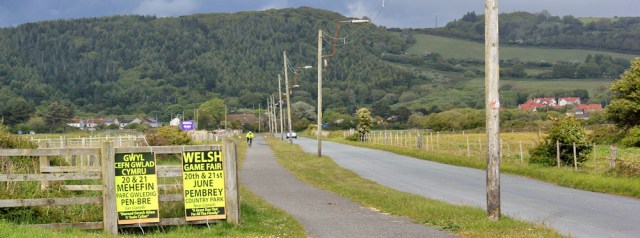 a20 slog inland along road to Pembrey bus, Ruth hiking in Wales