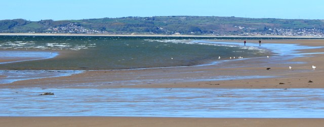 x03 Ruth walking on Whiteford Sands, Gower, Wales Coast Path